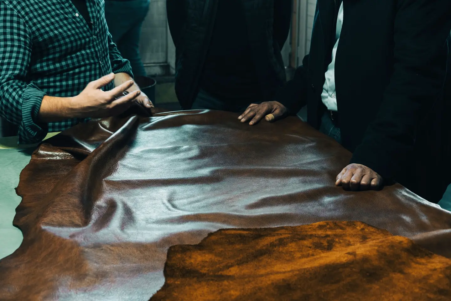Hands checking the finish of a product up close